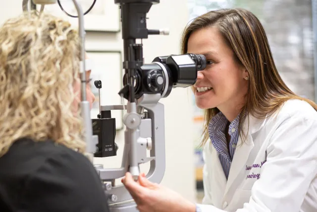 Ophthalmologist examining a patient at the slit lamp